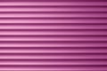 Abstract pink striped background, light metal shutters. Siding texture. Dirty ribbed surface with straight lines. Colored exterior