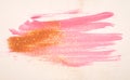 Abstract pink watercolor splash and golden glitter in vintage nostalgic colors.