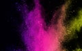 Abstract powder splatted background. Colorful powder explosion on black background. Colored cloud. Colorful dust explode. Paint Ho Royalty Free Stock Photo