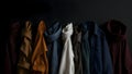 Abstract presentation of different types of clothes on dark background Royalty Free Stock Photo