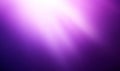 Abstract purple light background with glowing rays, perfect for space-themed design or as a dynamic wallpaper Royalty Free Stock Photo