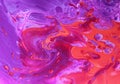 Abstract purple-orange background with iridescent paint. Royalty Free Stock Photo