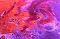 Abstract purple-orange background with iridescent paint. Royalty Free Stock Photo