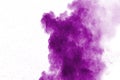 Abstract purple powder explosion on white background. Freeze motion of purple dust splash Royalty Free Stock Photo