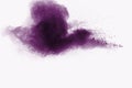 Abstract purple powder explosion on white background, Freeze motion of purple dust splashing Royalty Free Stock Photo