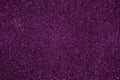 Abstract purple shiny background. Dark pink textile texture. Sparkly  fabric backdrop. Material, paper design. Royalty Free Stock Photo