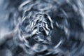 Abstract radial zoom tunnel, crumpled silver aluminum foil closeup background texture, blue textured pattern perspective