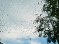 Abstract, Rain drops on car glass with blurred background. Royalty Free Stock Photo