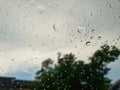 Abstract, Rain drops on car glass with blurred background. Royalty Free Stock Photo