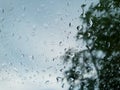 Abstract, Rain drops on car glass with blurred background. Royalty Free Stock Photo