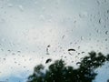 Abstract, Rain drops on car glass with blurred background. Royalty Free Stock Photo