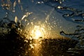 Gold Sunset abstract rain on the car front windshield Royalty Free Stock Photo