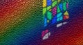 Abstract rainbow colored textured leather surface with colorful stained glass light patterns Royalty Free Stock Photo
