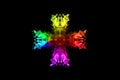 Abstract rainbow smoke cross isolated on black background