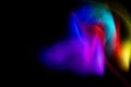 Abstract rainbow on textured black background. Long exposure. Light painting photography Royalty Free Stock Photo