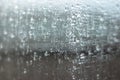 Abstract raindrops on a window glass surface Royalty Free Stock Photo