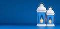 An abstract Ramadan celebration backdrop in deep blue, featuring a golden lantern Royalty Free Stock Photo