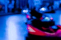 Abstract random colourful defocused blurred go-kart cars of fun fair background pattern