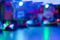 Abstract random colourful defocused blurred go-kart cars of fun fair background pattern