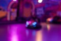 Abstract random colourful defocused blurred go-kart cars of fun fair background pattern