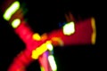 Abstract random colourful defocused blurred night life of fun fair background pattern