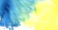 Abstract real watercolor background. Yellow spot iridescently flowing into blue blot. Bicolor Grab. Lots of small splashes. Royalty Free Stock Photo