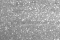 Sparkly glitter, silver grey background bokeh effect Royalty Free Stock Photo