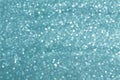 Sparkly glitter, turquoise background bokeh effect Royalty Free Stock Photo