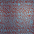 Abstract Red and Blue Squiggle Pattern. A dynamic pattern of red squiggles against a vivid blue background