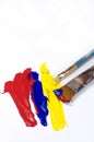 Abstract Red, Blue and Yellow Acrylic Paint and Brushes Royalty Free Stock Photo