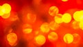 Abstract red blurred background with golden bright circles