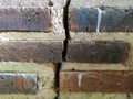 abstract background of a red brick wall that is cracked due to age Royalty Free Stock Photo