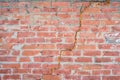 Abstract red broken brick wall texture with big crack in the middle Royalty Free Stock Photo