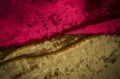 Abstract red and golden velvet fabric background texture Royalty Free Stock Photo