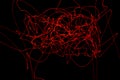 Abstract red lines drawn by light on a black background Royalty Free Stock Photo