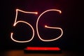 Abstract red lines long exposure light shape of 5G. Network internet mobile wireless Innovations in the future 5G