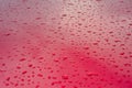 Abstract red metal background. Wet rain drops on the metal red car after rain. Royalty Free Stock Photo