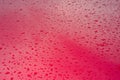 Abstract red metal background. Wet rain drops on the metal red car after rain. Royalty Free Stock Photo