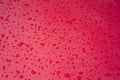 Abstract red metal background. Wet rain drops on the metal red car after rain. Royalty Free Stock Photo