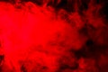 Abstract red-orange smoke hookah on a black background. Royalty Free Stock Photo