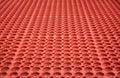 Abstract red perforated plastic background Royalty Free Stock Photo