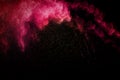 Abstract red powder explosion on black background. Royalty Free Stock Photo