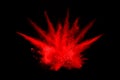 Abstract red powder explosion on black background.abstract red powder splatted on black background. Royalty Free Stock Photo