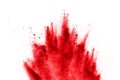 Abstract red powder explosion on white background. abstract red dust splattered on background.