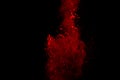 Abstract Red powder splatted background,Freeze motion of red powder exploding/throwing green dust. Royalty Free Stock Photo