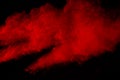 Abstract Red powder splatted background,Freeze motion of red powder exploding/throwing green dust. Royalty Free Stock Photo