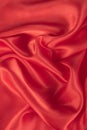 Abstract red silk satin fabric texture background.