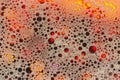 Abstract red, white background. Colored soap foam texture. Gel foam with bubbles Royalty Free Stock Photo