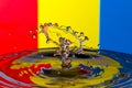 Abstract red, yellow and blue water drop collision Royalty Free Stock Photo