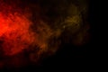 Abstract red and yellow smoke hookah on a black background. Royalty Free Stock Photo